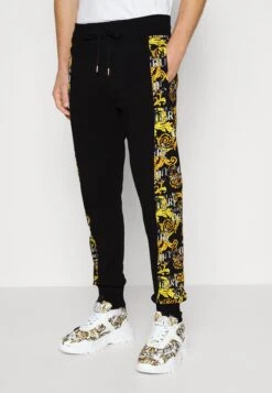 Versace Jeans CouturePRINT LOGO COUTURE - Träningsbyxor - Black/gold
