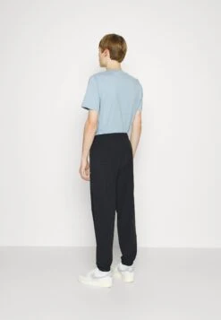 Champion RochesterELASTIC CUFF PANTS - Träningsbyxor - Black -Stil och Komfort Butik 61aca09057924e91ac4733fe39b9d404